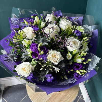 Cool Breeze - A beautifully composed bouquet with a contemporary palette of white and purple flowers.