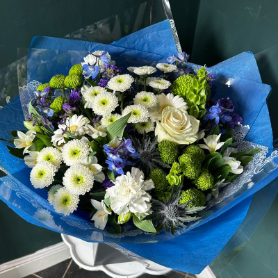 Serenity Bouquet - A calming bouquet featuring white roses, green chrysanthemums, and blue delphiniums.