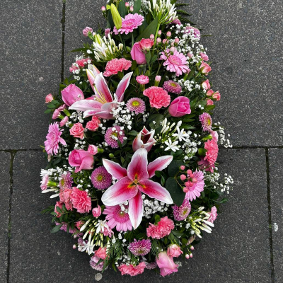 Graceful Farewell Spray - An elegant teardrop-shaped spray with pink lilies, carnations, and roses. Perfect for expressing heartfelt condolences at funerals.