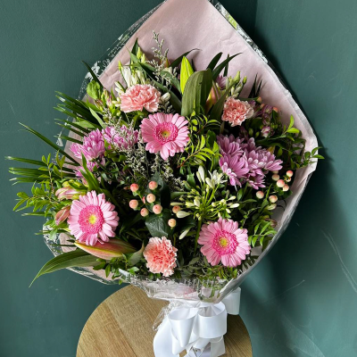 Pink Elegance Bouquet - A lovely bouquet of pink gerberas, carnations, and chrysanthemums. Suitable for expressing sympathy and support.