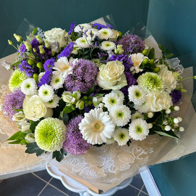 Elegant Sympathy Bouquet - A sophisticated bouquet featuring white roses, purple statice, and green chrysanthemums. Suitable for expressing heartfelt condolences and support.