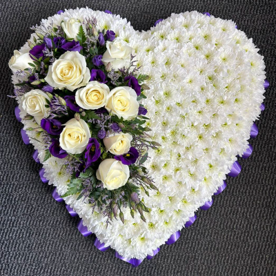 Heartfelt Sympathy Heart - A heart-shaped floral arrangement with white roses, purple lisianthus, and chrysanthemums. Ideal for expressing sympathy and heartfelt condolences.