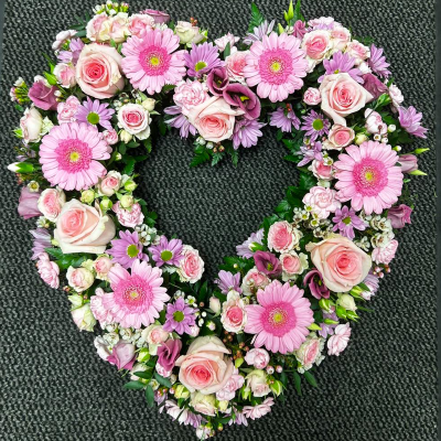 Pink Love Heart - A beautifully crafted heart-shaped arrangement featuring pink gerberas, roses, and chrysanthemums. Suitable for commemorating special moments and honoring loved ones.