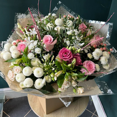 Pastel Delight Arrangement - A soft and elegant bouquet featuring pink and white roses, spray carnations, and chrysanthemums. Suitable for any occasion requiring a gentle touch.