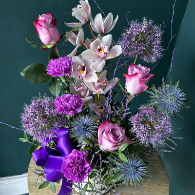 Lavender Elegance Arrangement - A striking bouquet of purple blooms. Ideal for making a bold statement of elegance and grace.