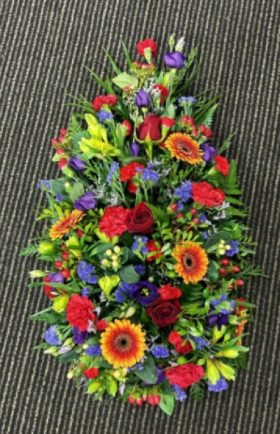 Rich Autumn - Rich Autumn is a single ended funeral oasis.

Made using rich colours or reds, oranges and blues with a pop of green this is the perfect tribute for a loved one. 

Product show is a medium 

Other prices available upon request