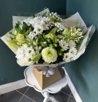 Ava - Ava is a hand tied bouquet in shades of white and green. 

This beautiful bouquet has white lily, rose and blooms with other season flowers. 

Please. Let this bouquet comes with lily as standard.