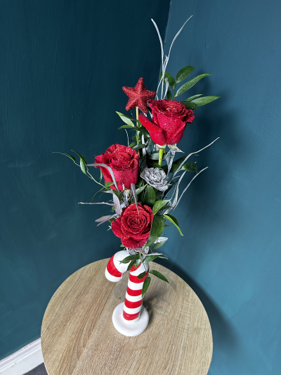 Candy Cane Love - Candy Cane Love is a limited edition on our Christmas 2024 list 

Featuring a trio of hand glittered roses with season foliage all presented in a fabulous candy cane vase! 

Limited number of these lovely vases available. Order now to get yours