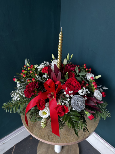 Bowlful of Joy - This wonderful slender candle arrangement is new for Christmas 2024

Made in a ceramic bowl and featuring a single slender candle this arrangement is full of traditional colours. 

With a lovely mix of seasonal foliage and flowers this is a beautiful gift to send your seasons greetings to your friends and family.

Please note candle colour may vary