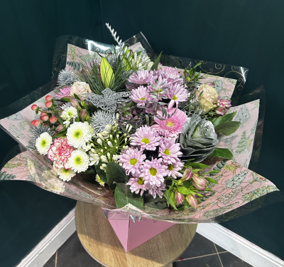 Angel Face - The very super pretty Angel Face is full of pink and white blooms, hand glittered roses and snow flocked thistle makes this hand tied bouquet sparkle. 
Made live on TikTok Angel face is part of our alternative Christmas range and makes a beautiful gift,